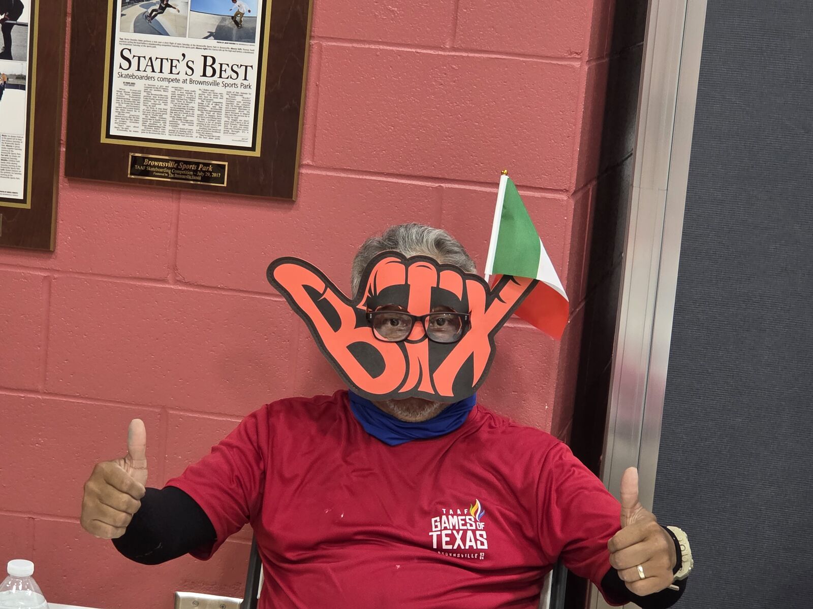 BTX fan with the hang loose sign