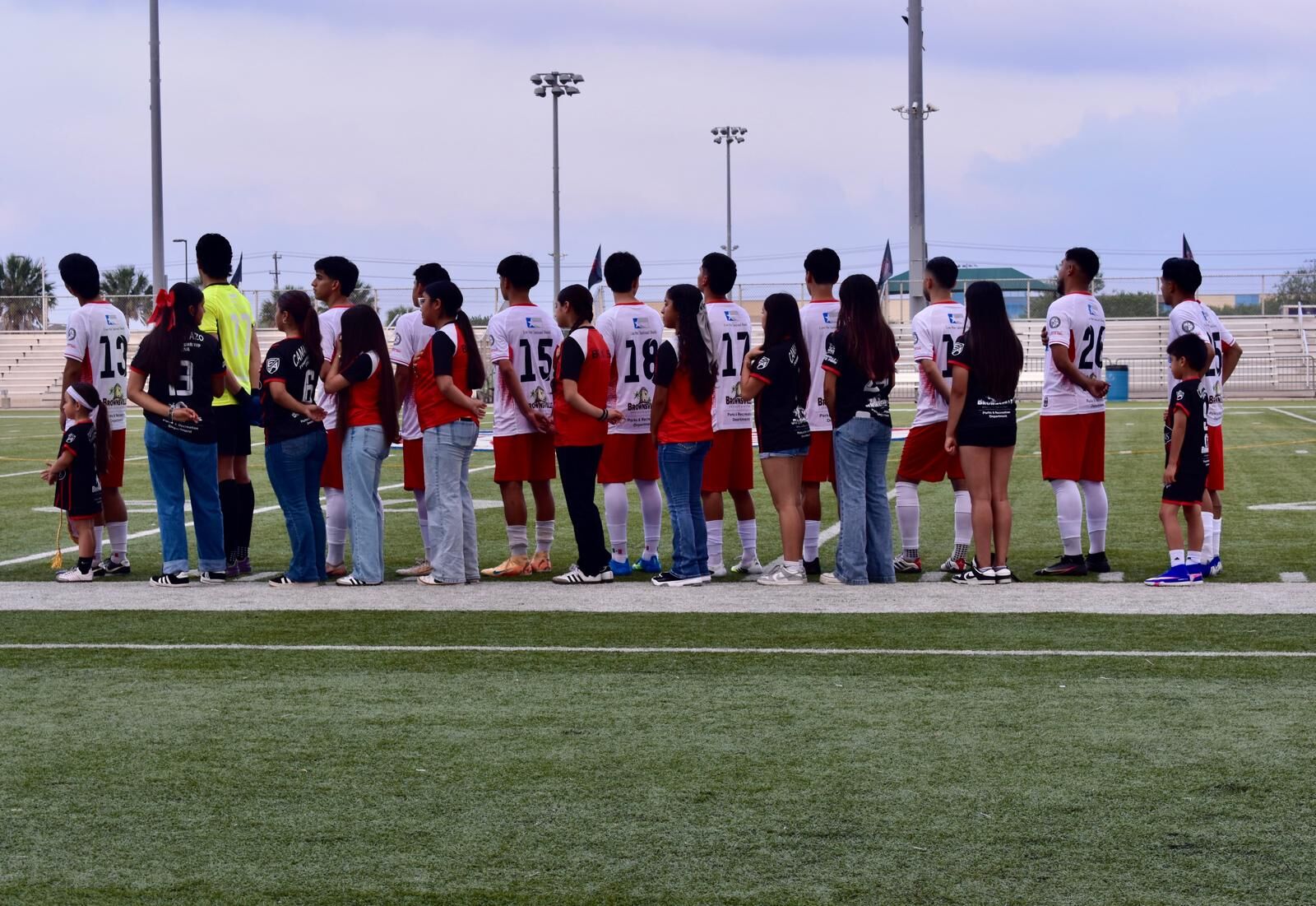 Semi-Pro team walking out with young fans